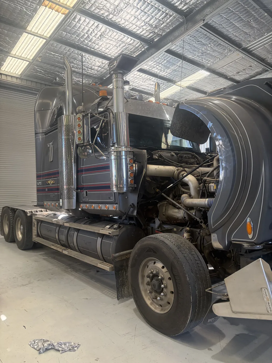 Western Star prime mover engine bay open for diesel tuning work